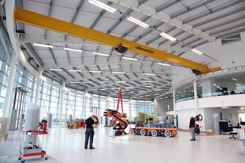 The circular, single girder crane is unlike any other we’ve manufactured before as it incorporates special end carriages that enable it to travel around the track of the circular building