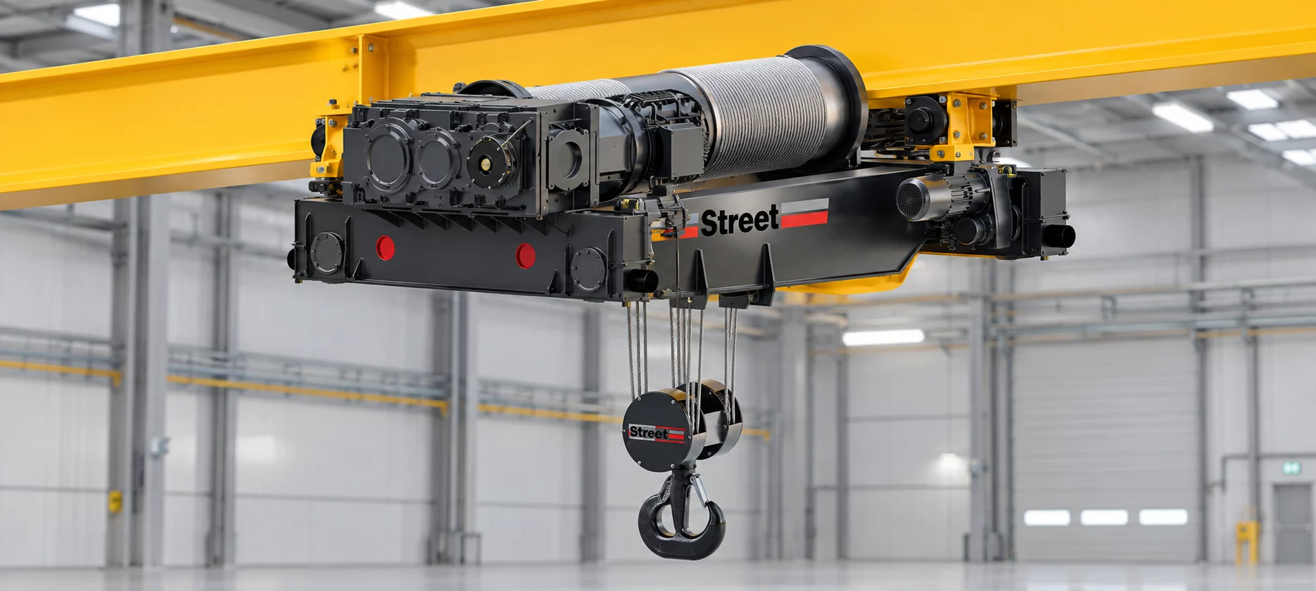 Street VX open winch hoist mounted beneath a yellow overhead beam